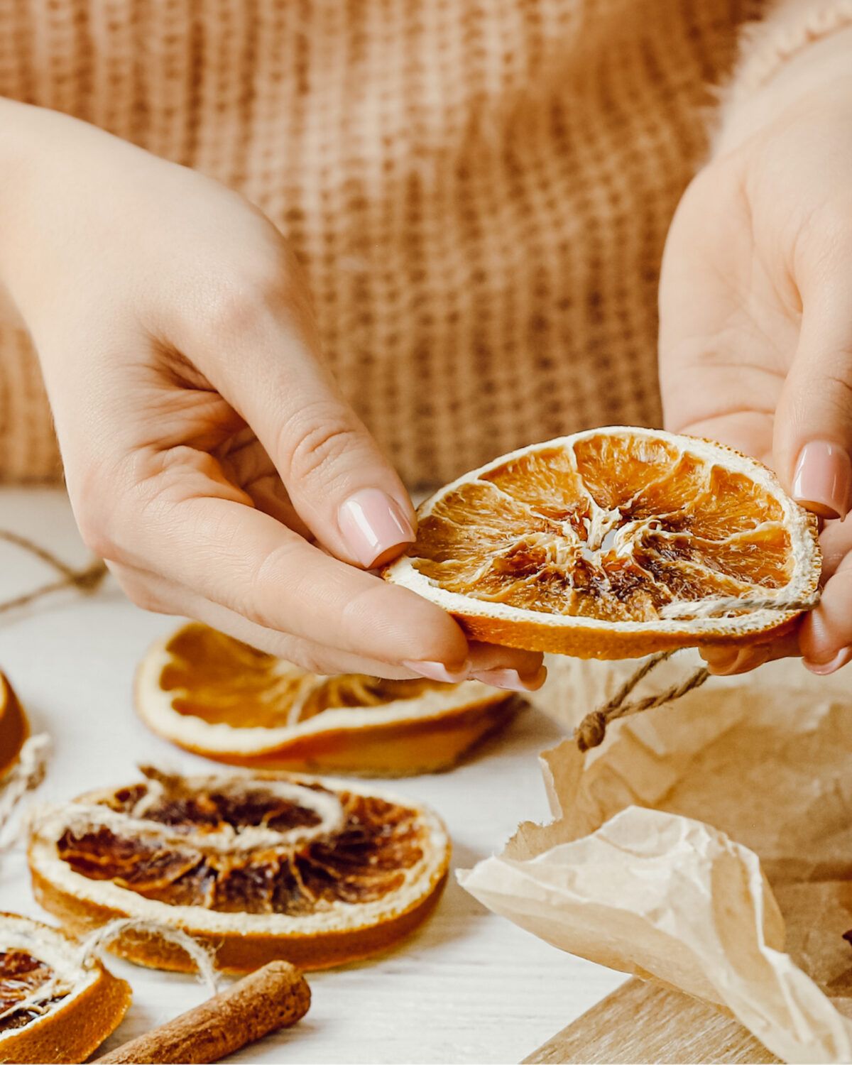 Dried orange slices for a Christmas garland made with navel oranges and kitchen twine.