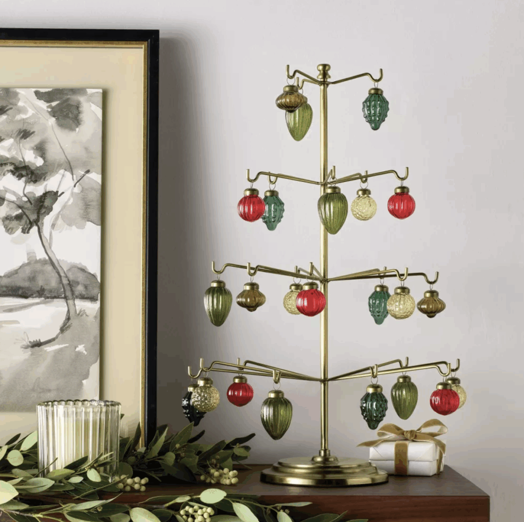 Hearth and Hand x Target holiday launch 2025 with a gold tree with hanging glass ornaments.