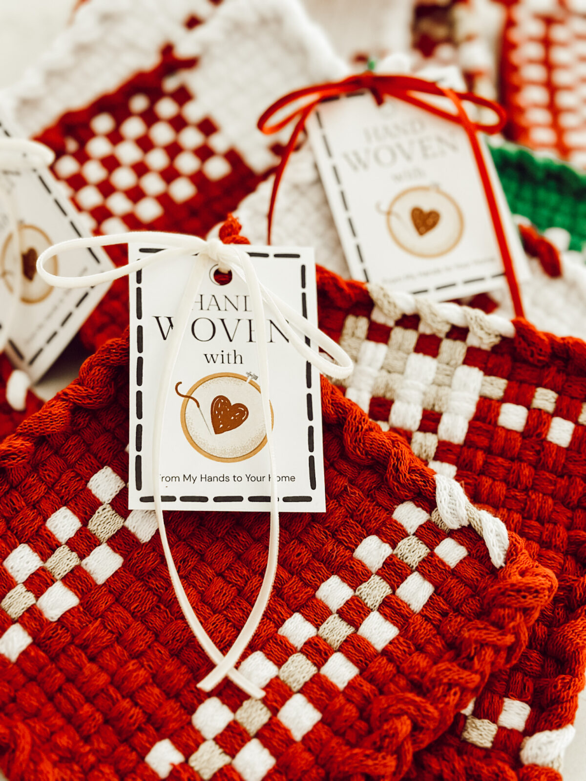 Hand woven potholders using a metal weaving loom. An easy grandma hobby that is calming and relaxing.