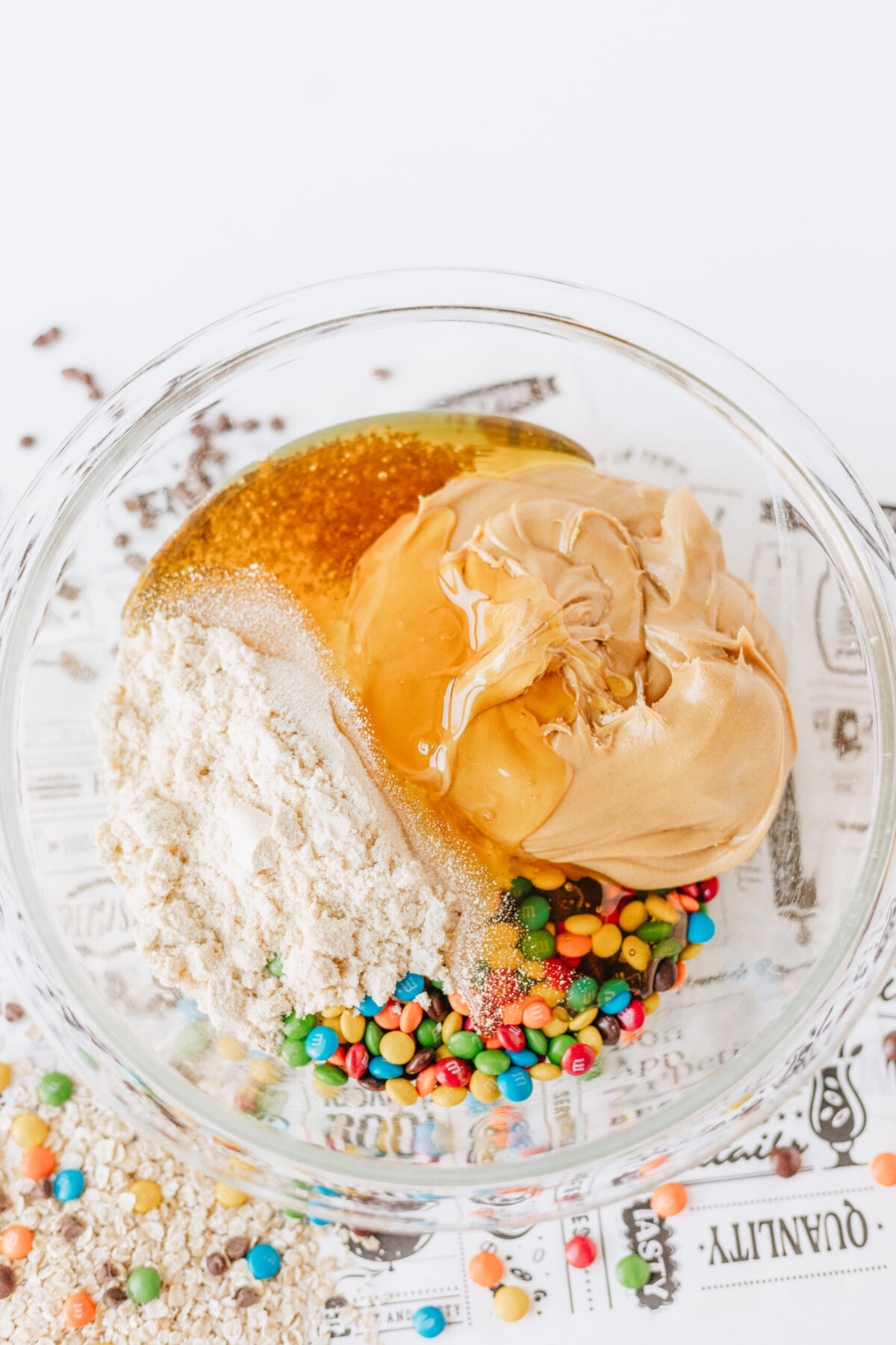 The ingredients you need to make cookie flavored energy balls include peanut butter, protein powder, candy, honey, and old fashioned oats.