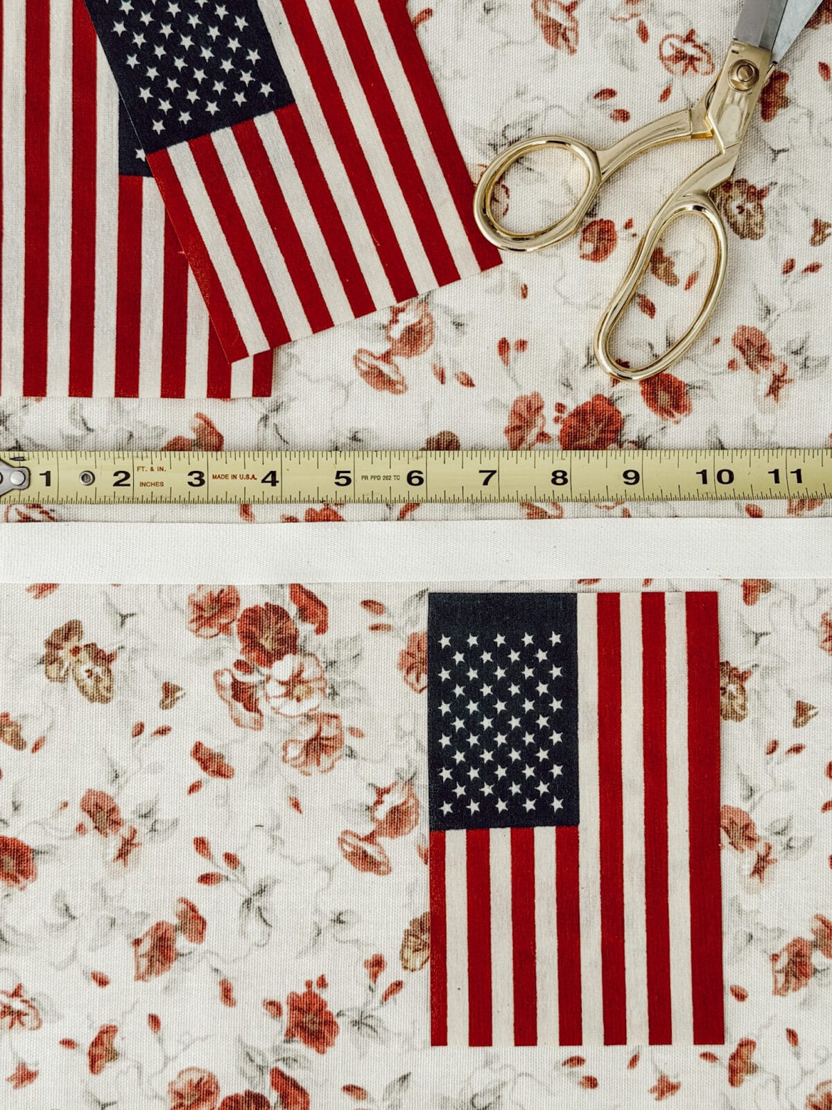 Using a measuring tape to measure where the American flags go on the ribbon garland.