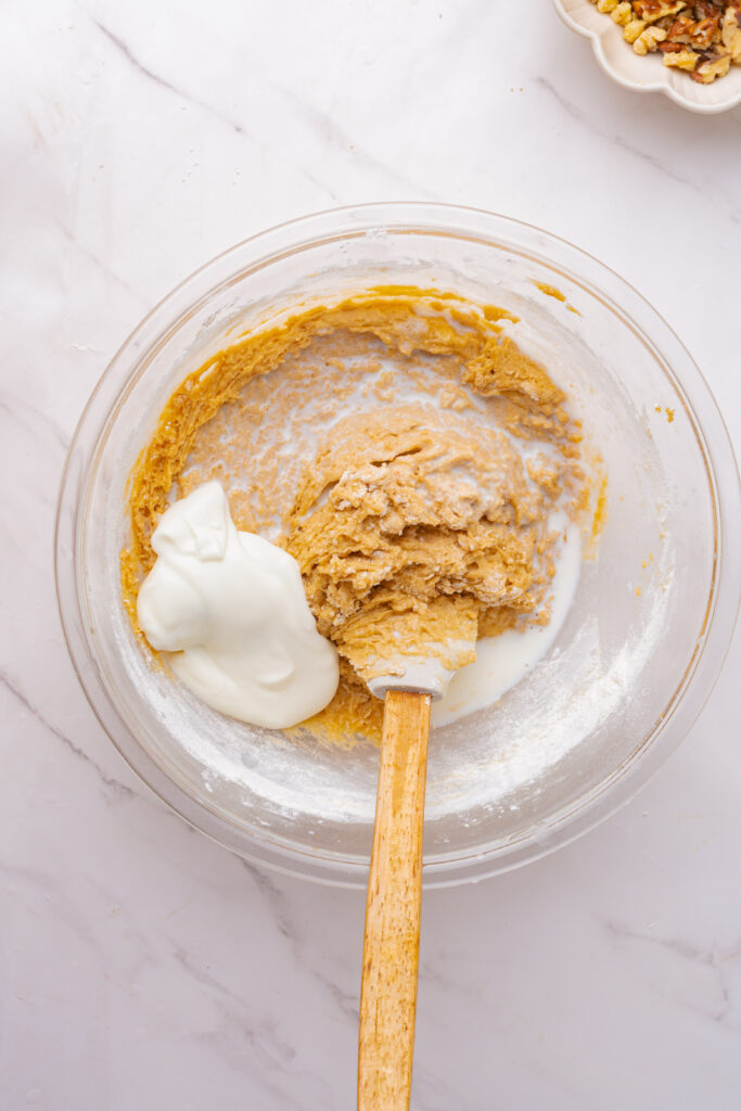 Sour cream mixed into coffee cake batter.