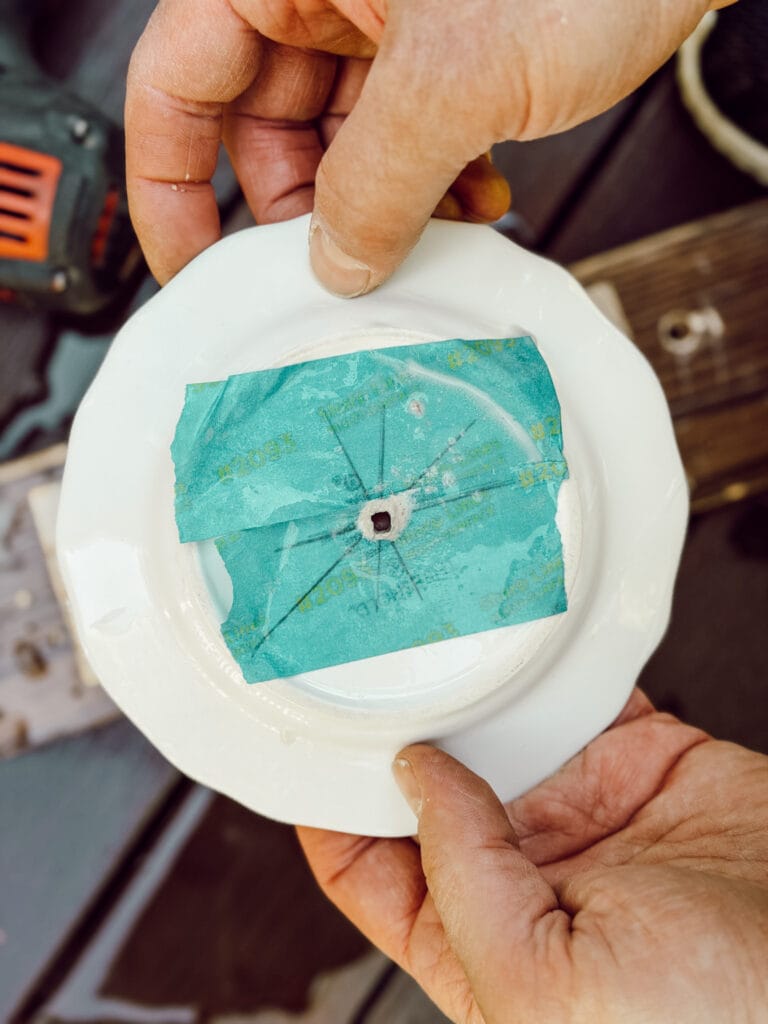 Small ceramic plate with a hole drilled in the middle to create a tiered stand.