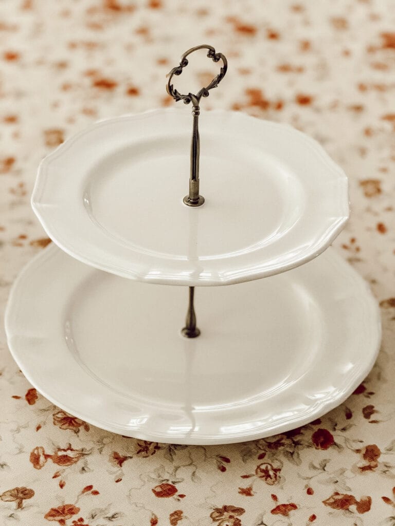 Finished 2-tiered tray for displaying decorations or baked goods for entertaining.