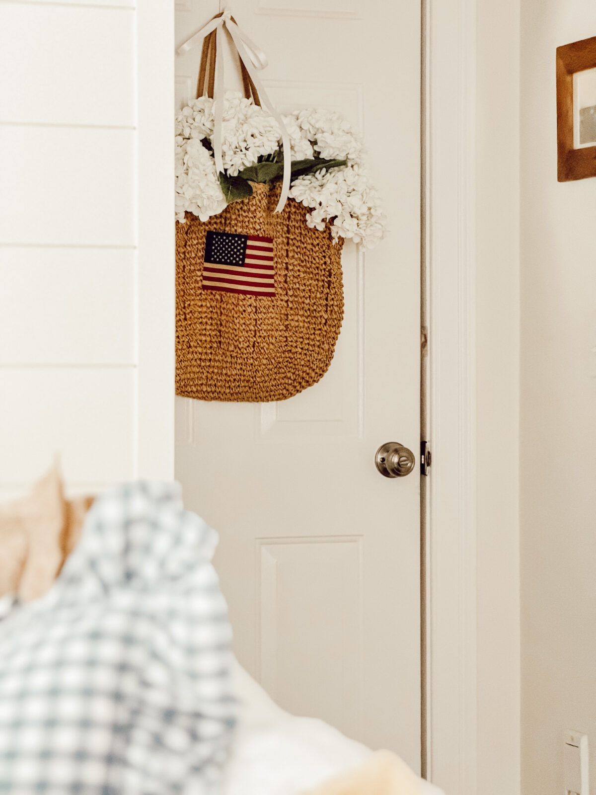DIY Americana door basket on interior door for cozy summer decor.