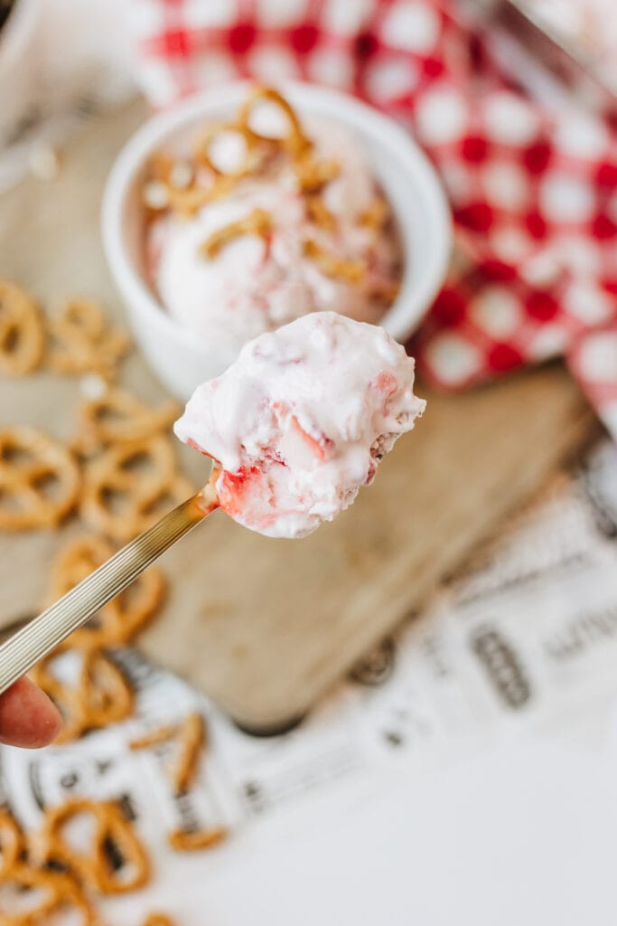 A spoonful of homemade cottage cheese ice cream that is a delicious frozen summer treat.