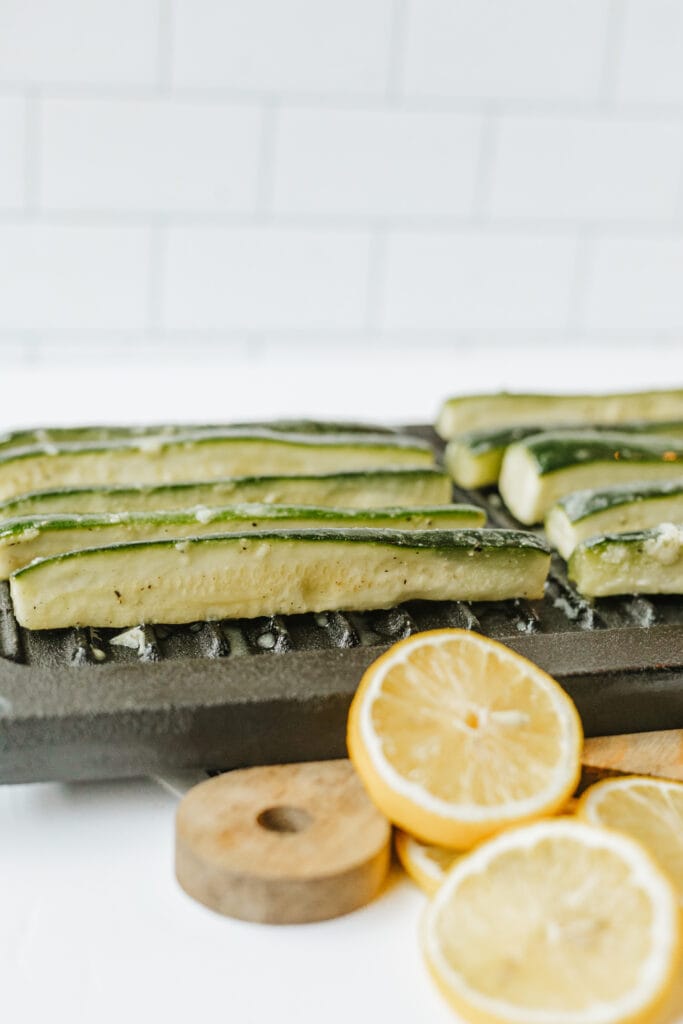 Honey dijon marinated zucchini squash on a grill pan to make an easy summer side dish.