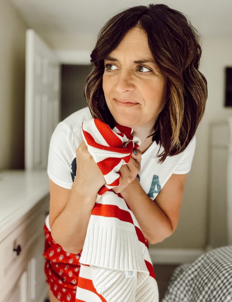 Patriotic clothes at Target include a zip up flag sweater, vintage style graphic tee's, and block print shorts in red, white, and blue colors.