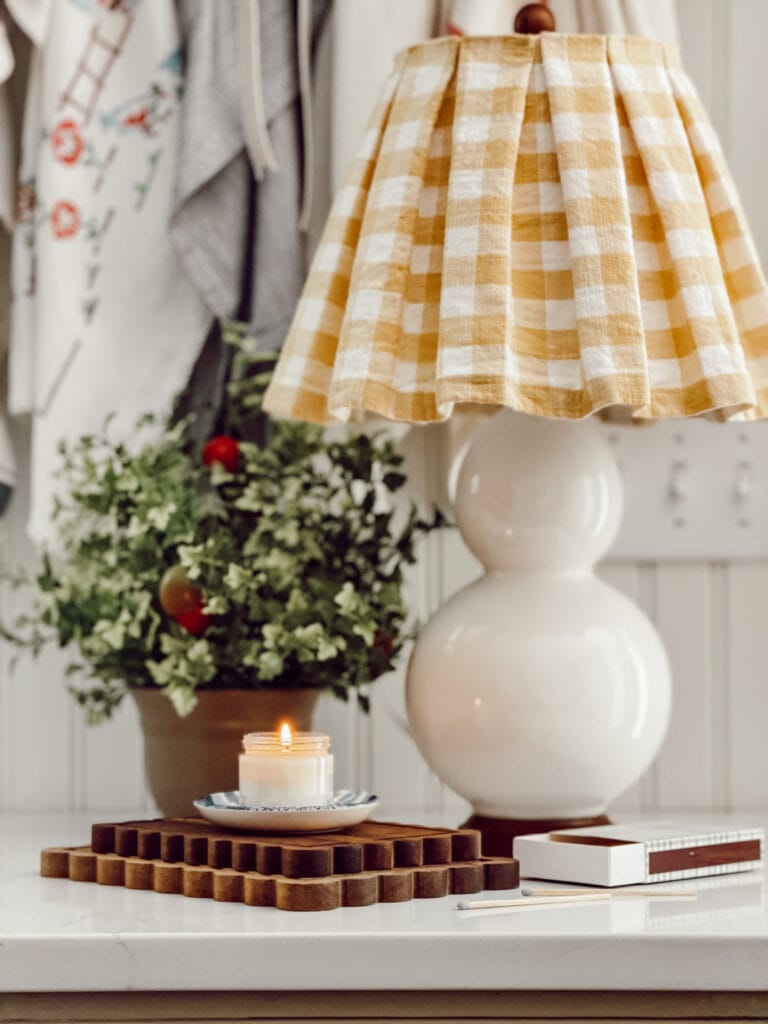 Weekly Wednesday Wish List #260 Eleanor Rose Home kitchen counter with a lamp, plant, and candle.