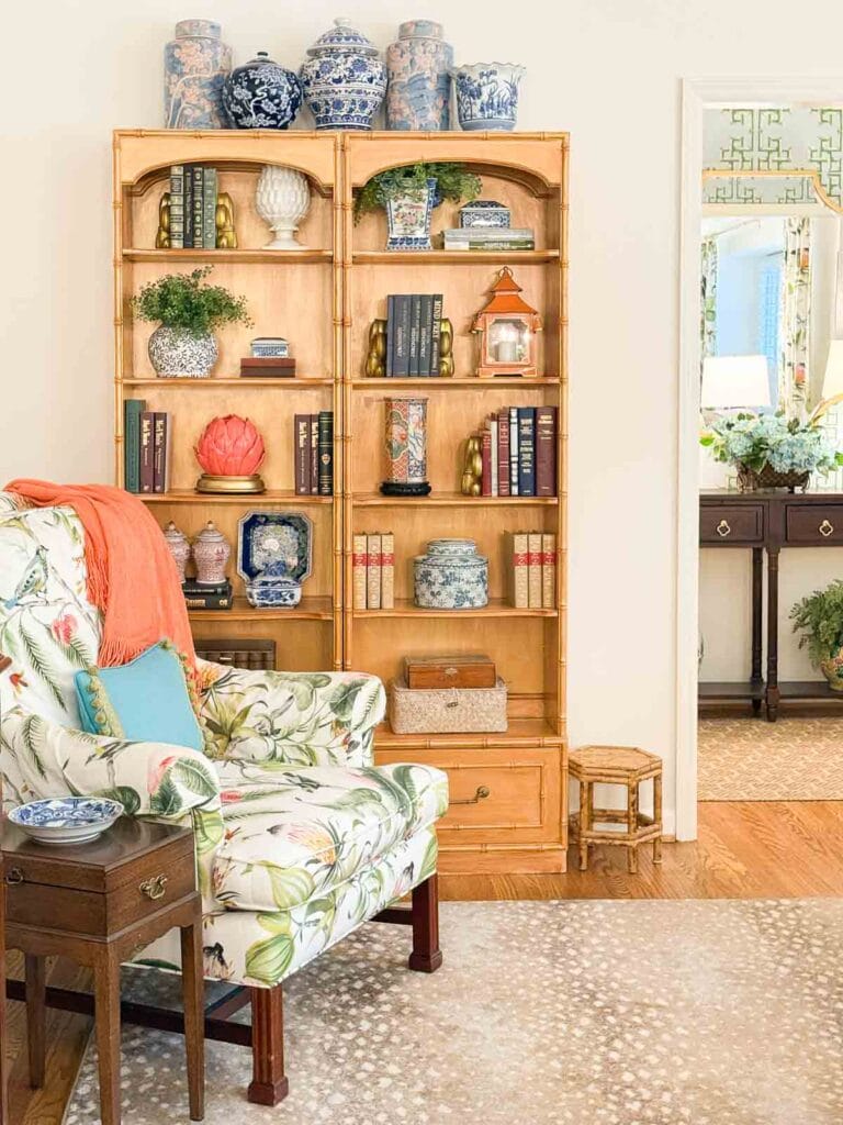 Weekly Wednesday Wish List #259 Worthing Court bookshelf in living room with accent chair.