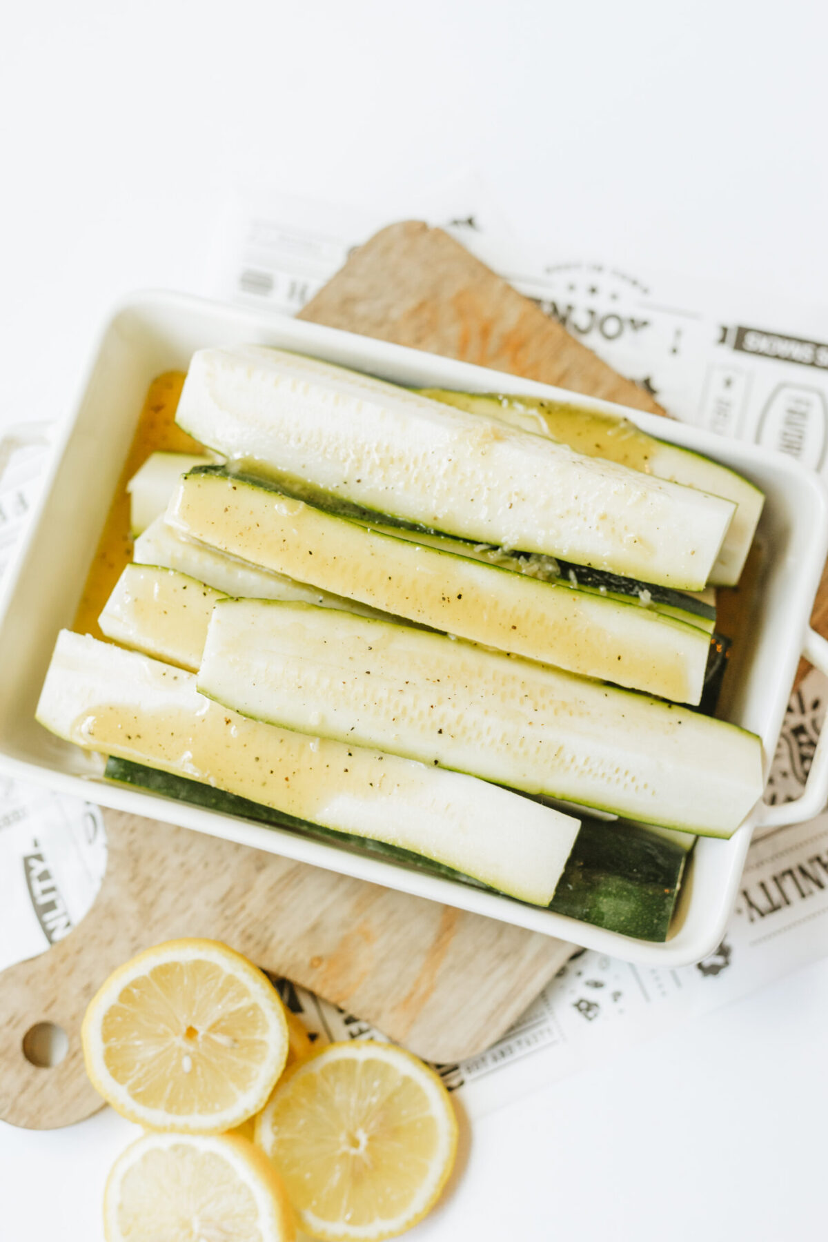 Place the zucchini spears in a bowl and allow to marinate for 4 to 6 hours before grilling.