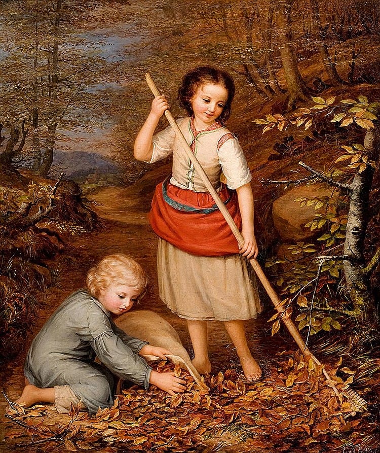Two children playing and raking autumn leaves in the fall.