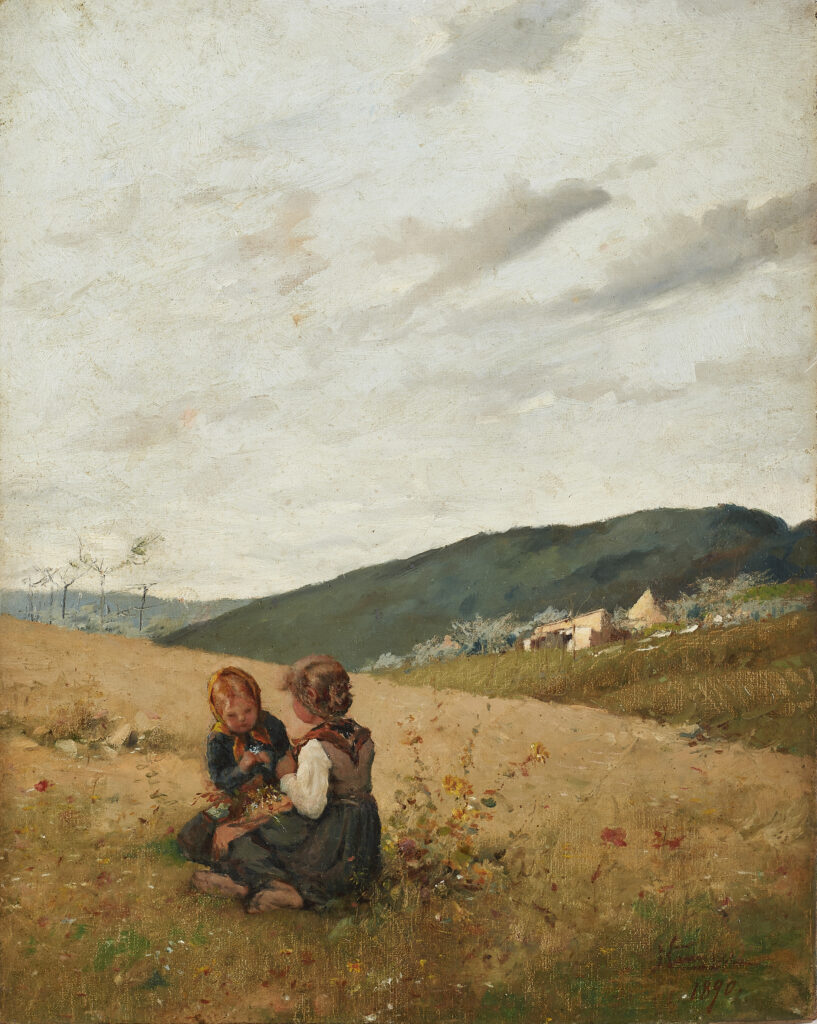 Children playing in a wheat field at harvest time in the country,