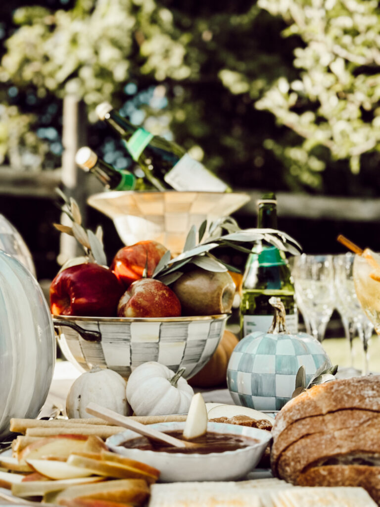Fresh apples and olive branhces in a decorative bowl for autumn.