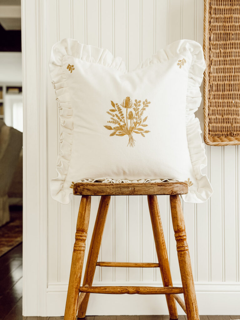 Weekly Wednesday Wish List #266 Eleanor Rose Home entryway with wooden chair and fall throw pillow.