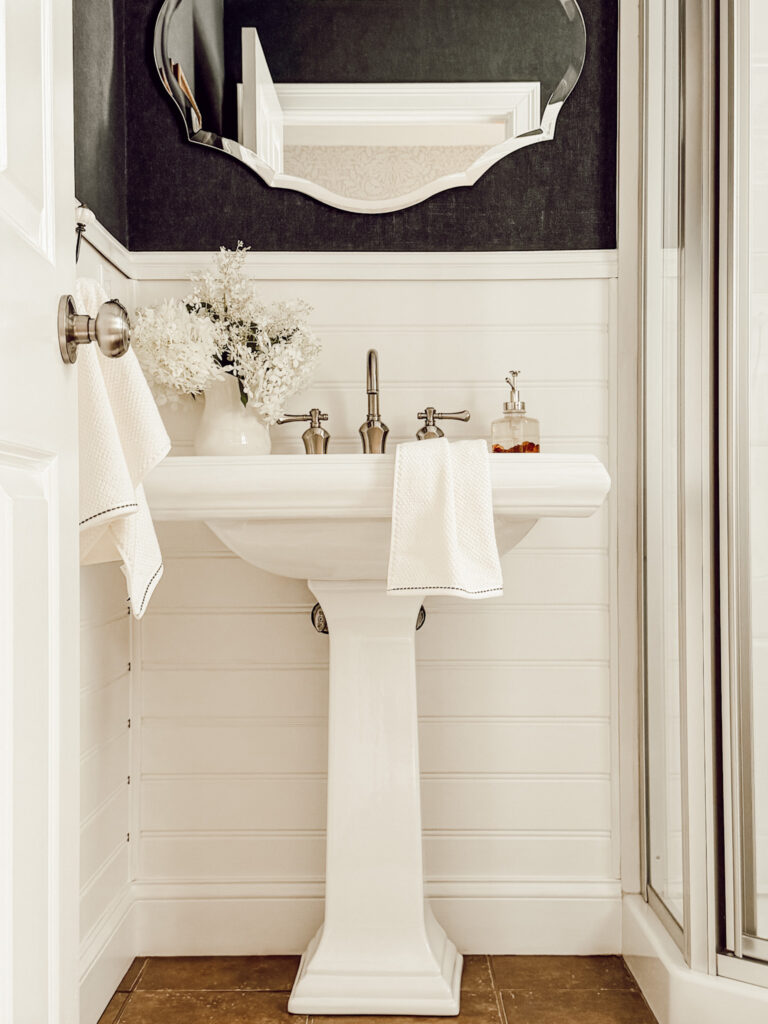 Cozy cottage bathroom decorated for the fall season.