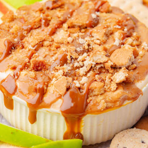 Easy caramel cheesecake apple dip with crushed vanilla wafers on top.
