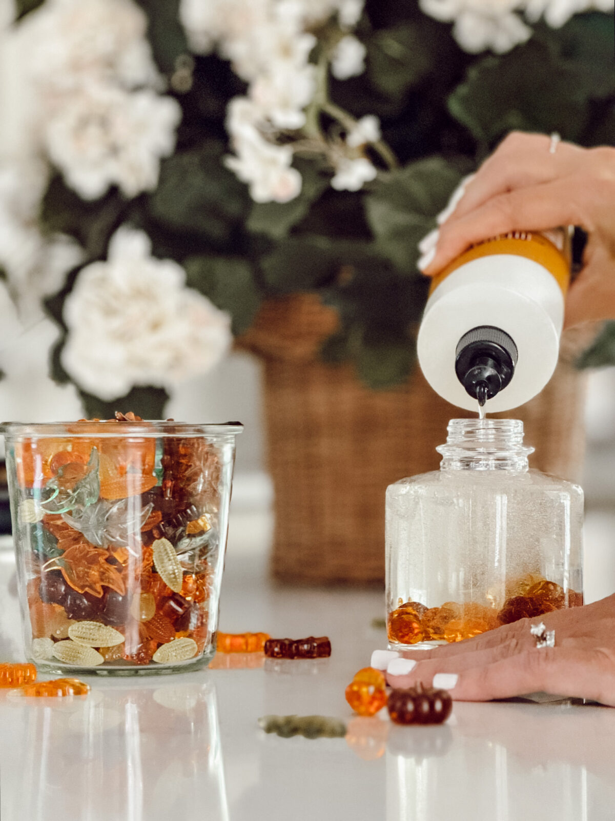After putting the fall acrylic shapes into the soap pump, add more hand soap on top to finish.