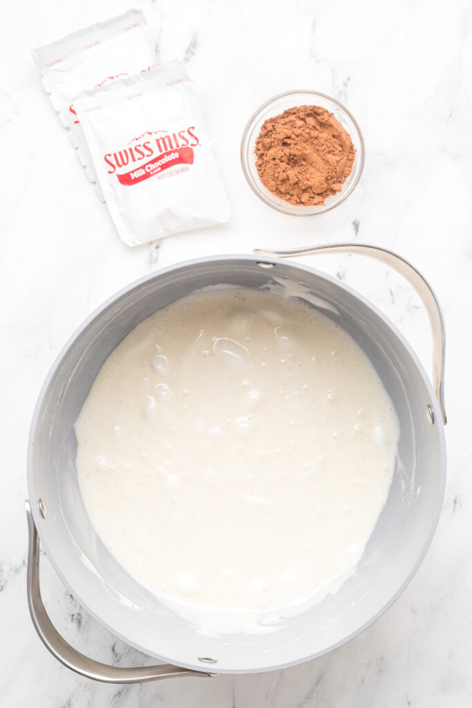 Melted mini marshmallows for hot chocolate Rice Krispie treats in a larget pot.