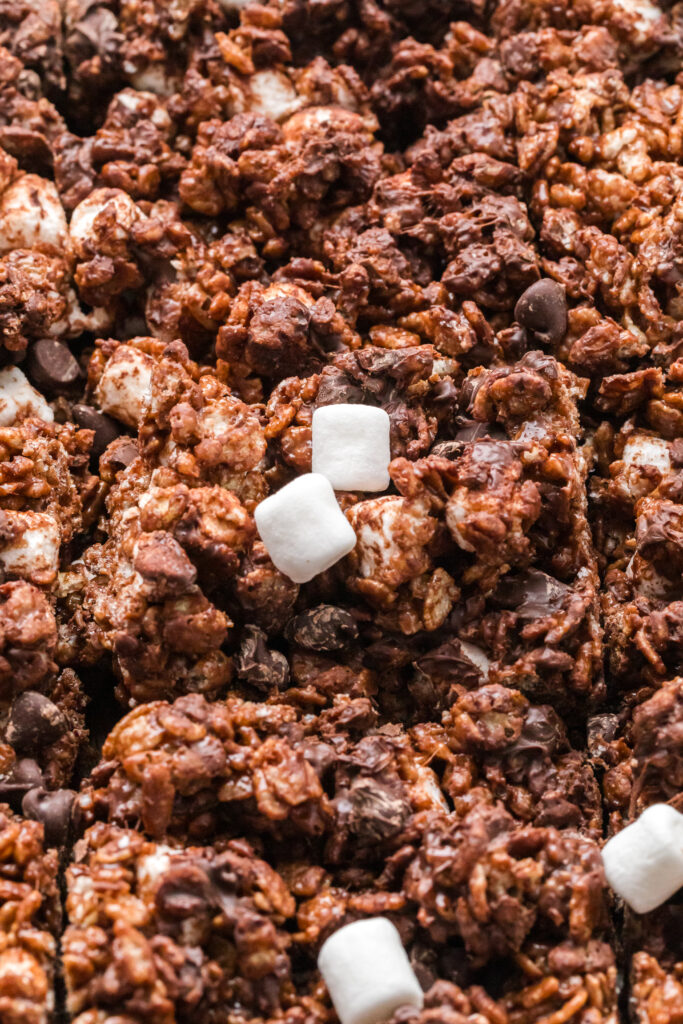 A close up of the mini marshmallows and chocolate chips folded into the cereal treat bars.