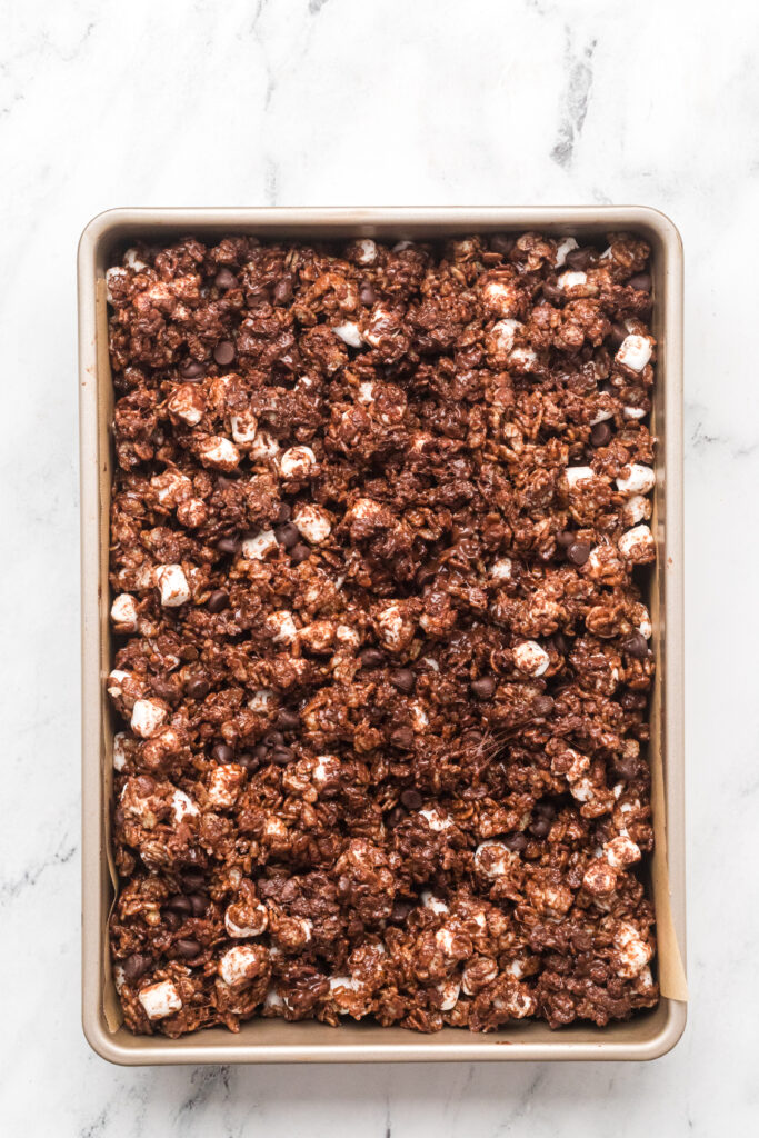 Press the cereal treat mixture in a baking pan and allow to cool before slicing.