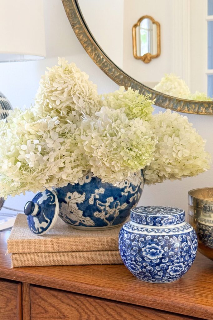 Weekly Wednesday Wish List #268 StoneGable console table with a vase of hydrangeas.