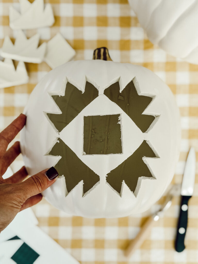 Carved pumpkin for Halloween decorating that isn't spooky or scary.