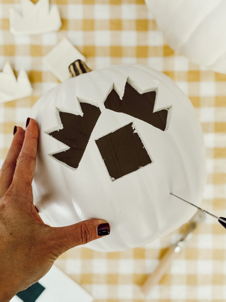 A quilt design carved into a pumpkin for cozy, nostalgic fall decorating.