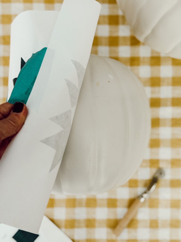 Remove the paper pattern to reveal the quilt design on the pumpkin.
