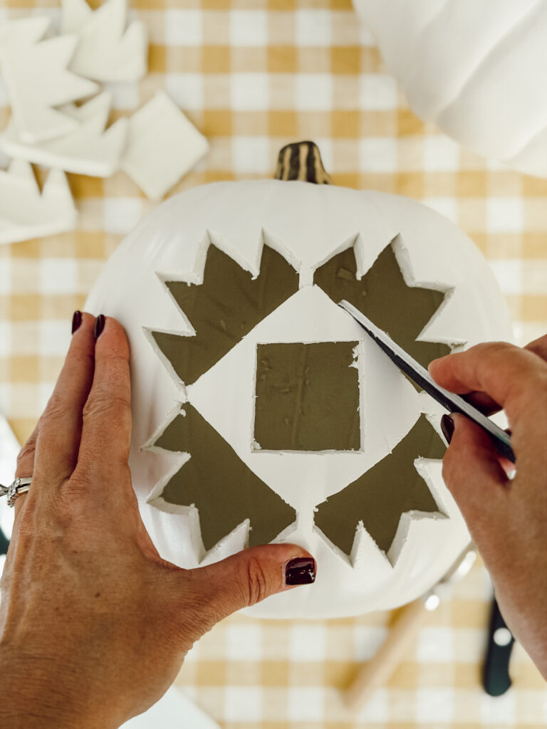 Using a nail file or fine grit sandpaper, sand the edge of the quilt design to give it a polished look.